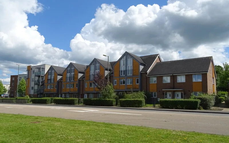 Houses and flats on Popley Way, Basingstoke. Which containers you get depends on the building: houses have their own wheeled bins, flats that share bin stores have communal ones